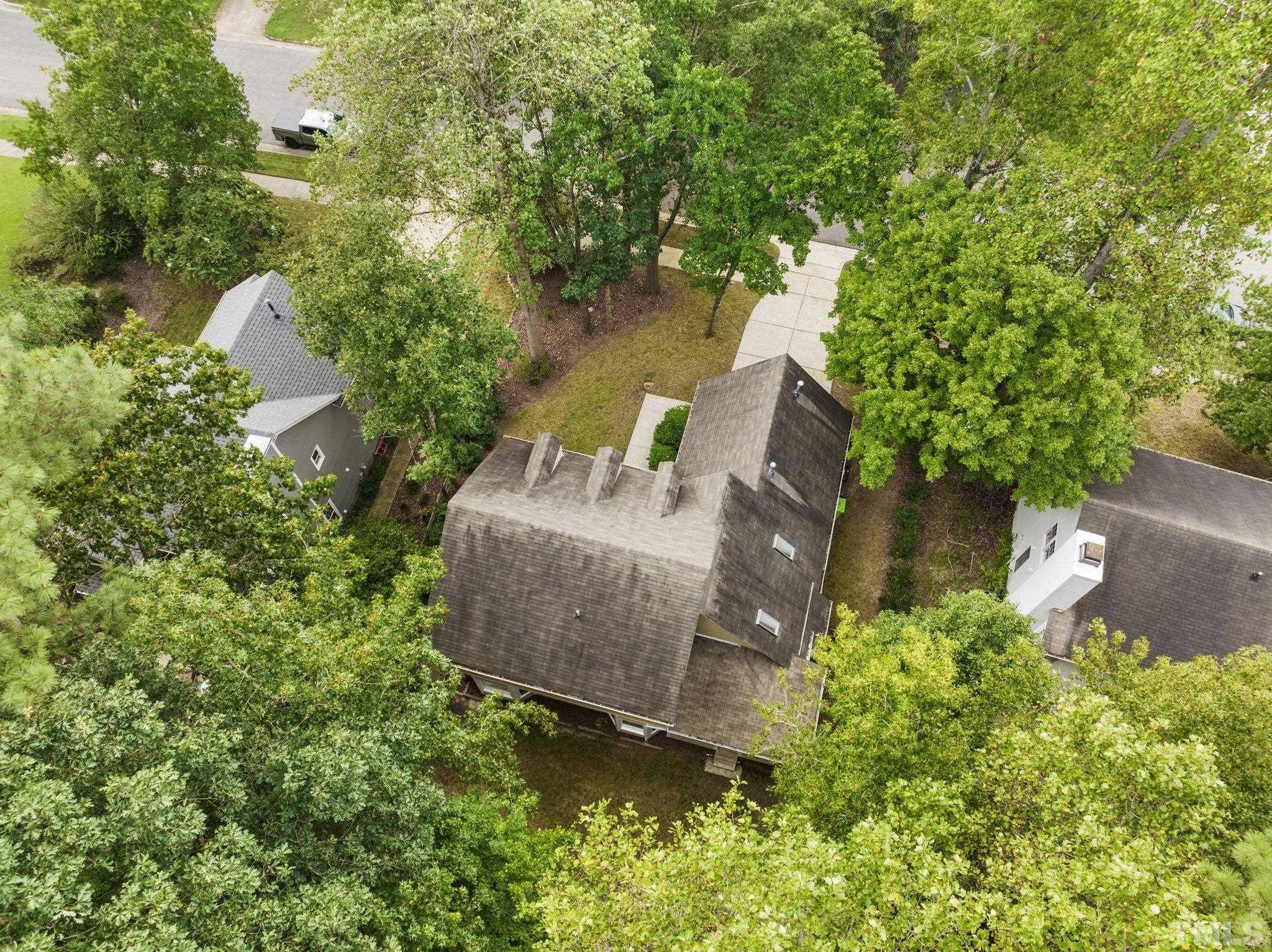 12028 North Exeter Way Raleigh, NC 27613 - Photo 47 of 48 an aerial view of a house with a yard basket ball court and outdoor seating
