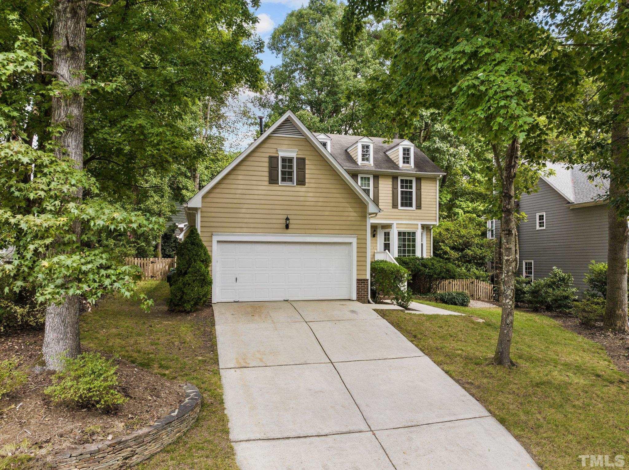 12028 North Exeter Way Raleigh, NC 27613 - Photo 5 of 48 a view of a house with a yard