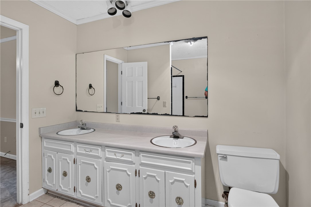 123 Robin Road Westminster, SC 29693 - Photo 32 of 50 Double vanity with ample counter space and storage cabinetry offers everyday convenience in this full bathroom.