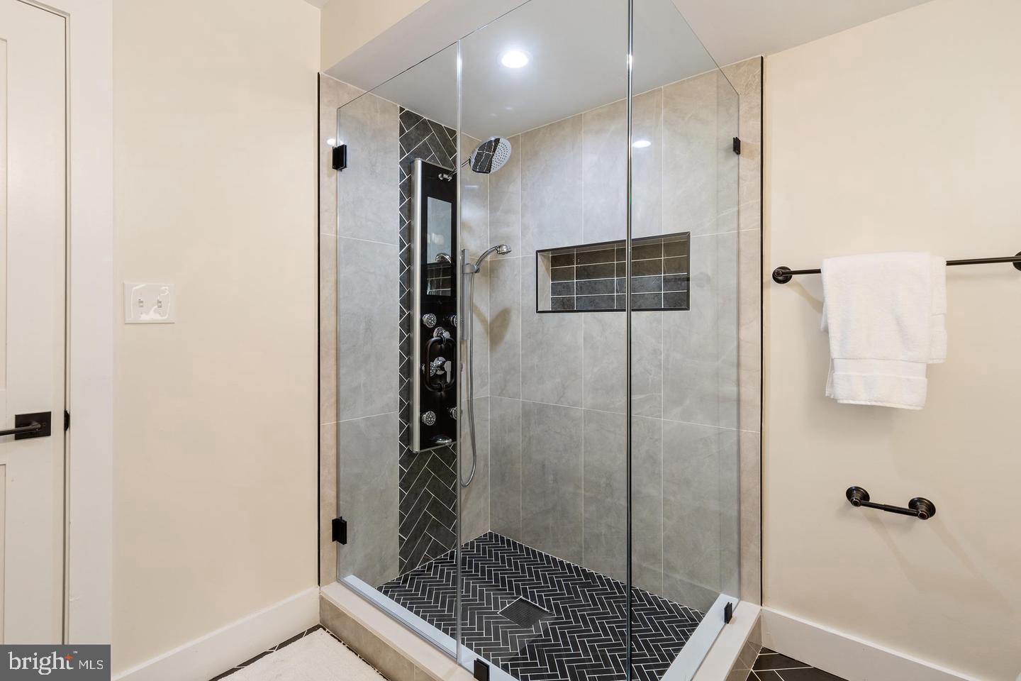 213 Bates Street Northwest, Unit 1 Washington, DC 20001 - Photo 22 of 28 a bathroom with a shower and a sink