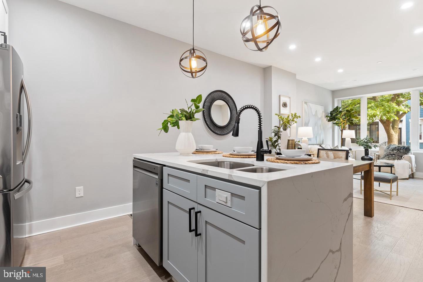 213 Bates Street Northwest, Unit 1 Washington, DC 20001 - Photo 7 of 28 a kitchen with a sink and a stove