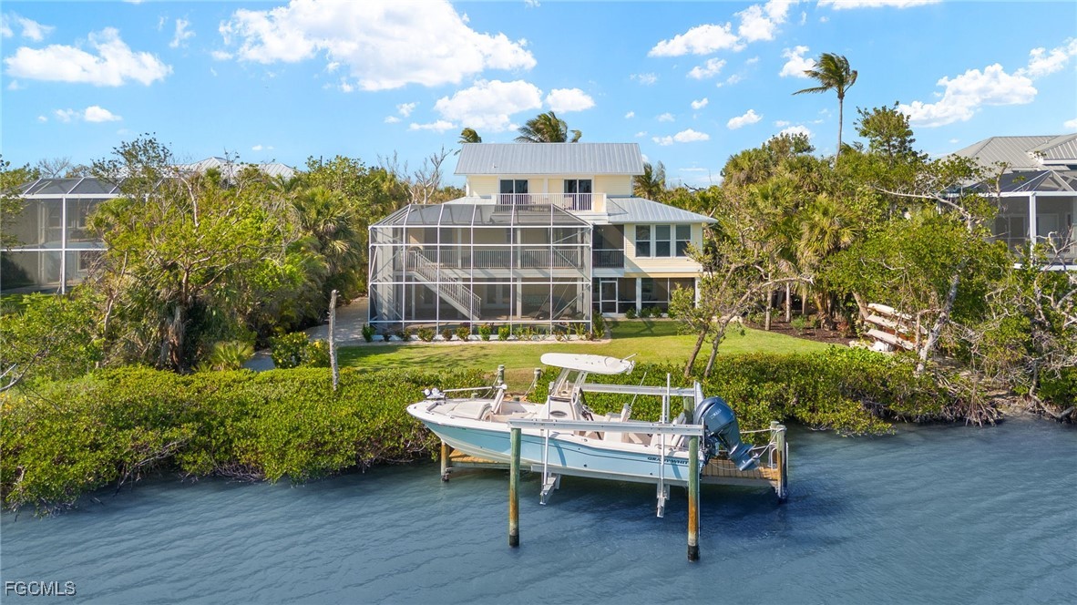 a front view of a house with a yard table and chairs