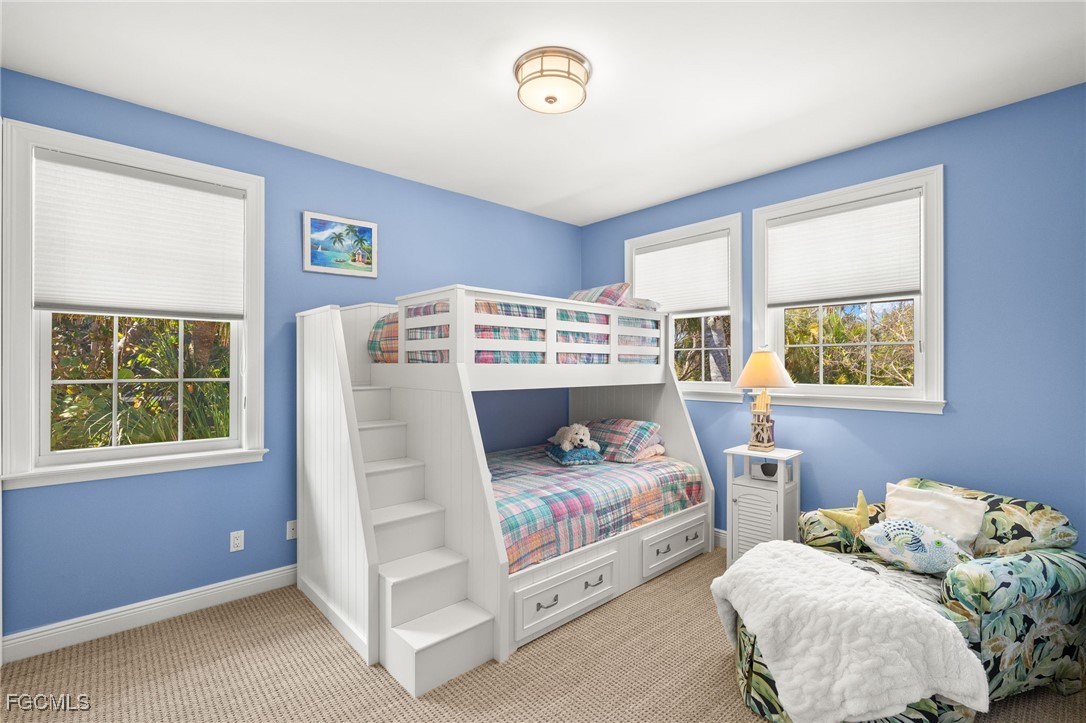 2391 Shop Road Sanibel, FL 33957 - Photo 17 of 50 a bedroom with bed and a window