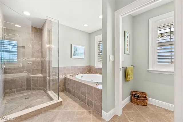 a bathroom with a bathtub and a shower