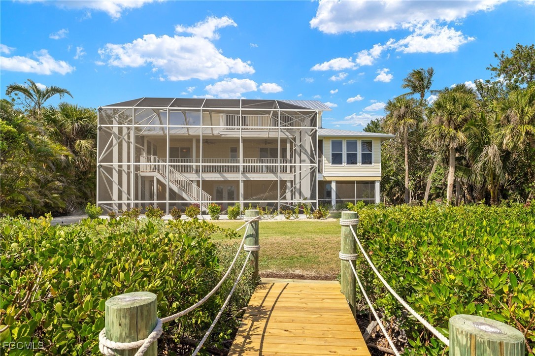2391 Shop Road Sanibel, FL 33957 - Photo 39 of 50 a house view with a garden space