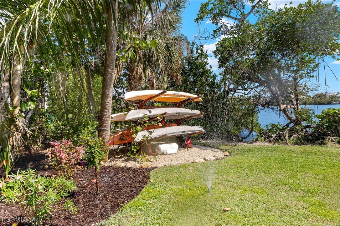 2391 Shop Road Sanibel, FL 33957 - Photo 41 of 50 a backyard of a house with lots of green space