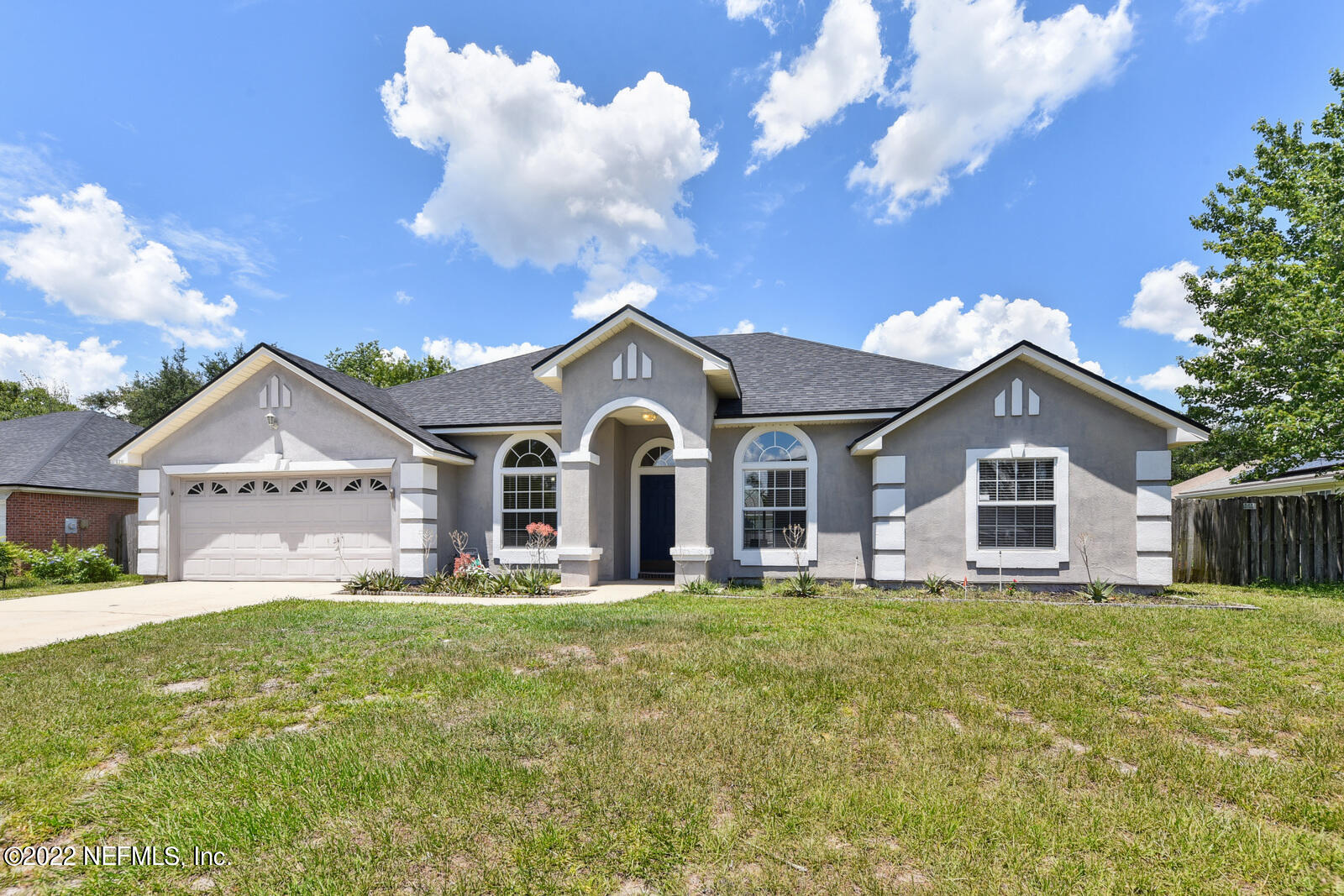 470 Federal Hill Road Orange Park, FL 32073 - Photo 1 of 26 a front view of a house with garden