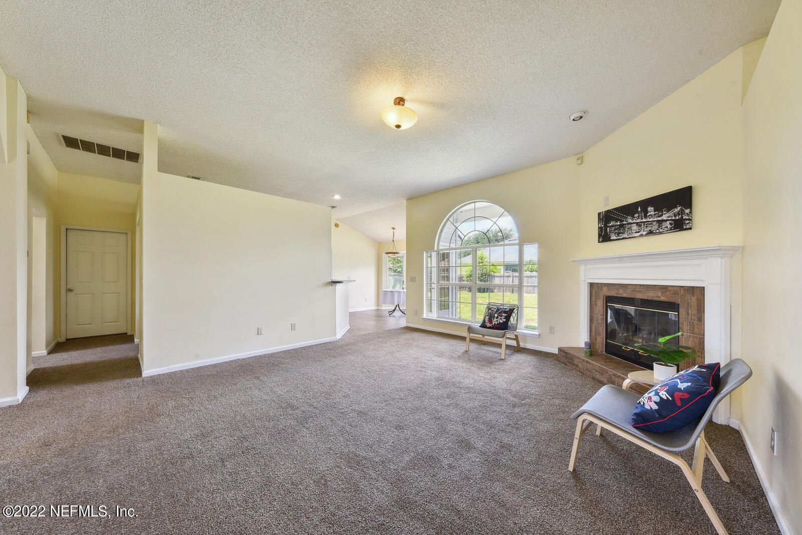 470 Federal Hill Road Orange Park, FL 32073 - Photo 16 of 26 an empty room with furniture and a fireplace