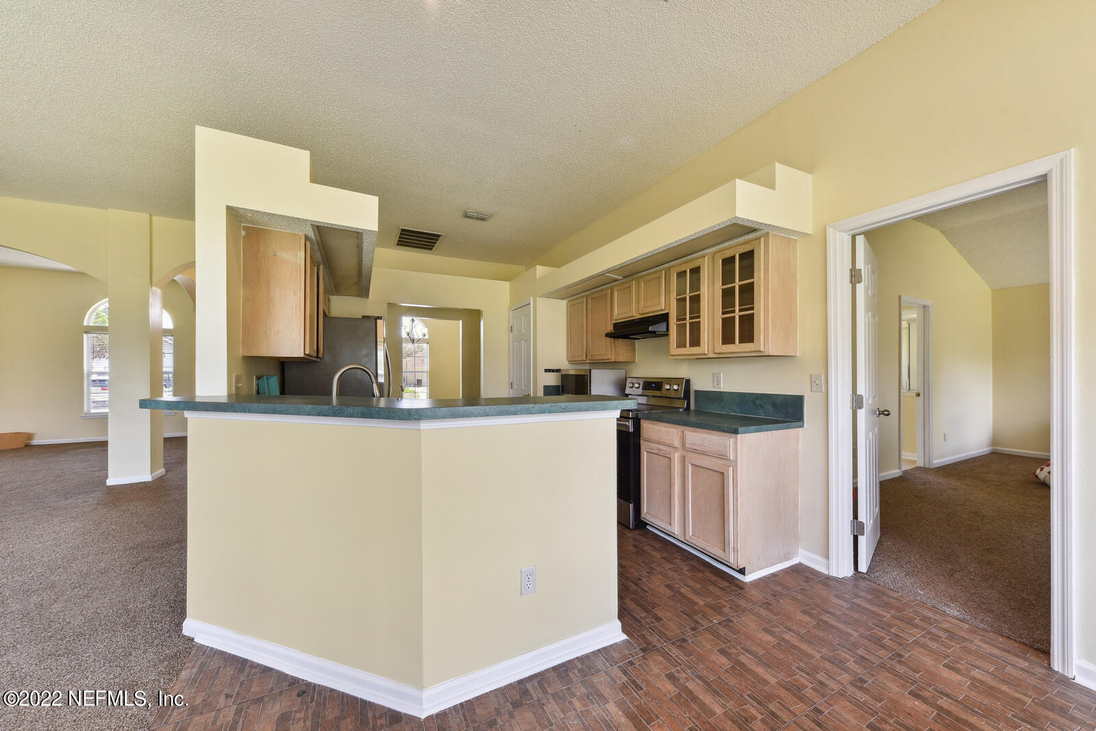 470 Federal Hill Road Orange Park, FL 32073 - Photo 17 of 26 a living room with stainless steel appliances granite countertop a refrigerator and a stove top oven