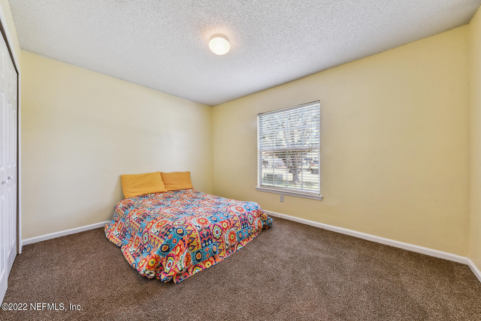 470 Federal Hill Road Orange Park, FL 32073 - Photo 21 of 26 a bedroom with a bed and a window