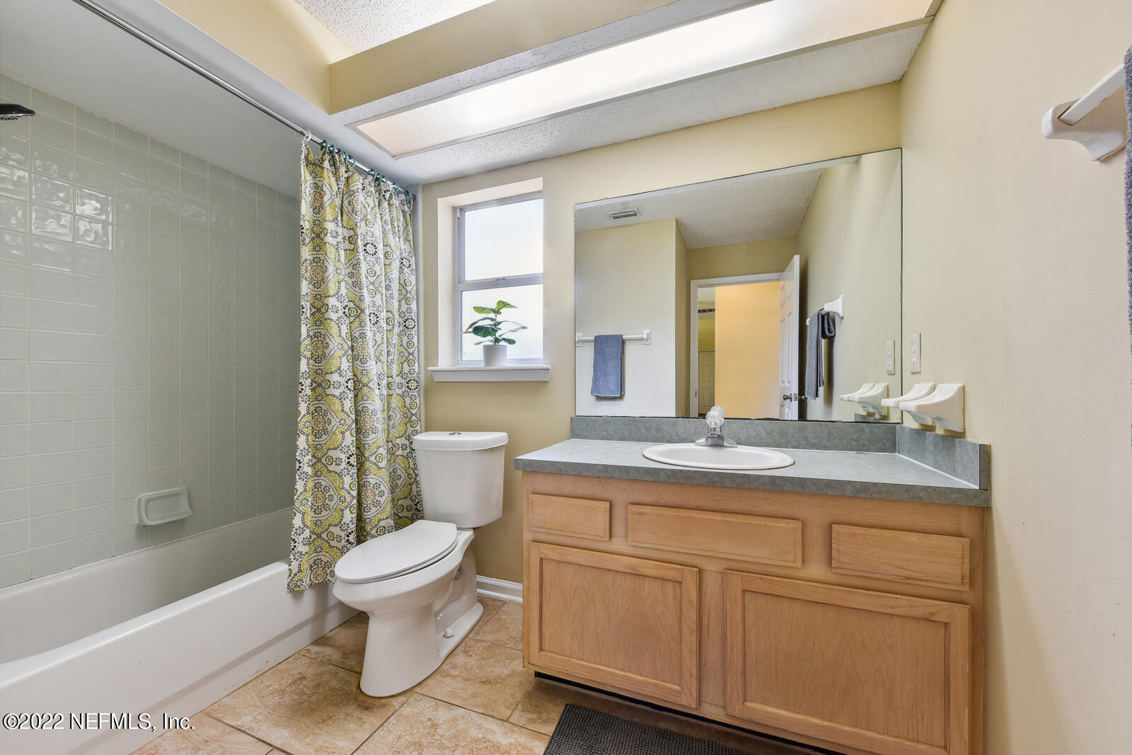 470 Federal Hill Road Orange Park, FL 32073 - Photo 22 of 26 a bathroom with a granite countertop toilet a sink and a bathtub