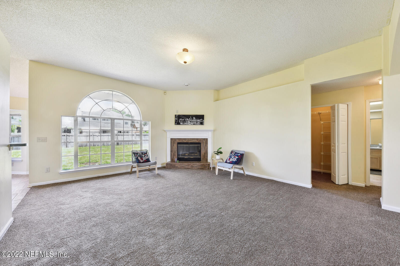 470 Federal Hill Road Orange Park, FL 32073 - Photo 3 of 26 an empty room with furniture and a fireplace
