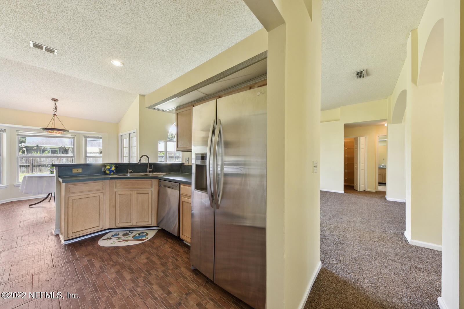 470 Federal Hill Road Orange Park, FL 32073 - Photo 4 of 26 a kitchen with stainless steel appliances granite countertop a refrigerator and a stove