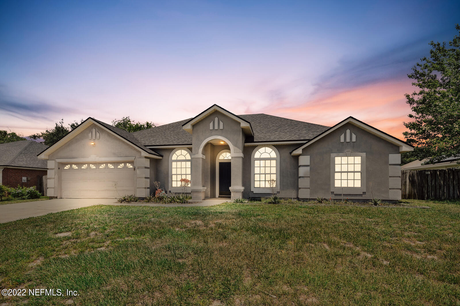 470 Federal Hill Road Orange Park, FL 32073 - Photo 9 of 26 a front view of a house with a yard and garage