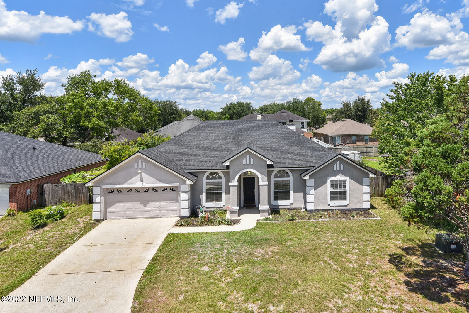470 Federal Hill Road Orange Park, FL 32073 - Photo 10 of 26 a front view of a house with a garden