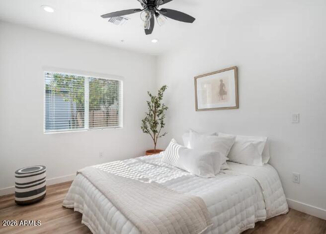 4202 North 10th Street, Unit 6 Phoenix, AZ 85014 - Photo 11 of 18 a bedroom with a bed and a window