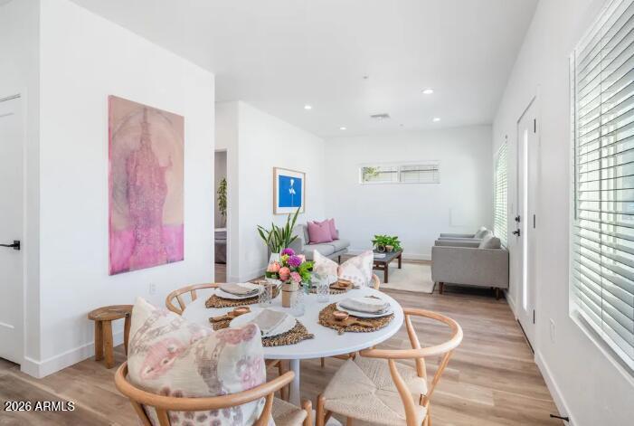 4202 North 10th Street, Unit 6 Phoenix, AZ 85014 - Photo 6 of 18 a living room with furniture and a wooden floor