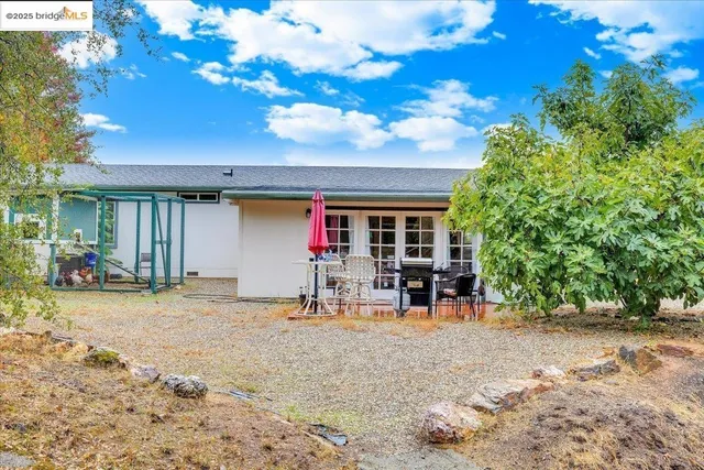 a view of the chairs and tables in the patio
