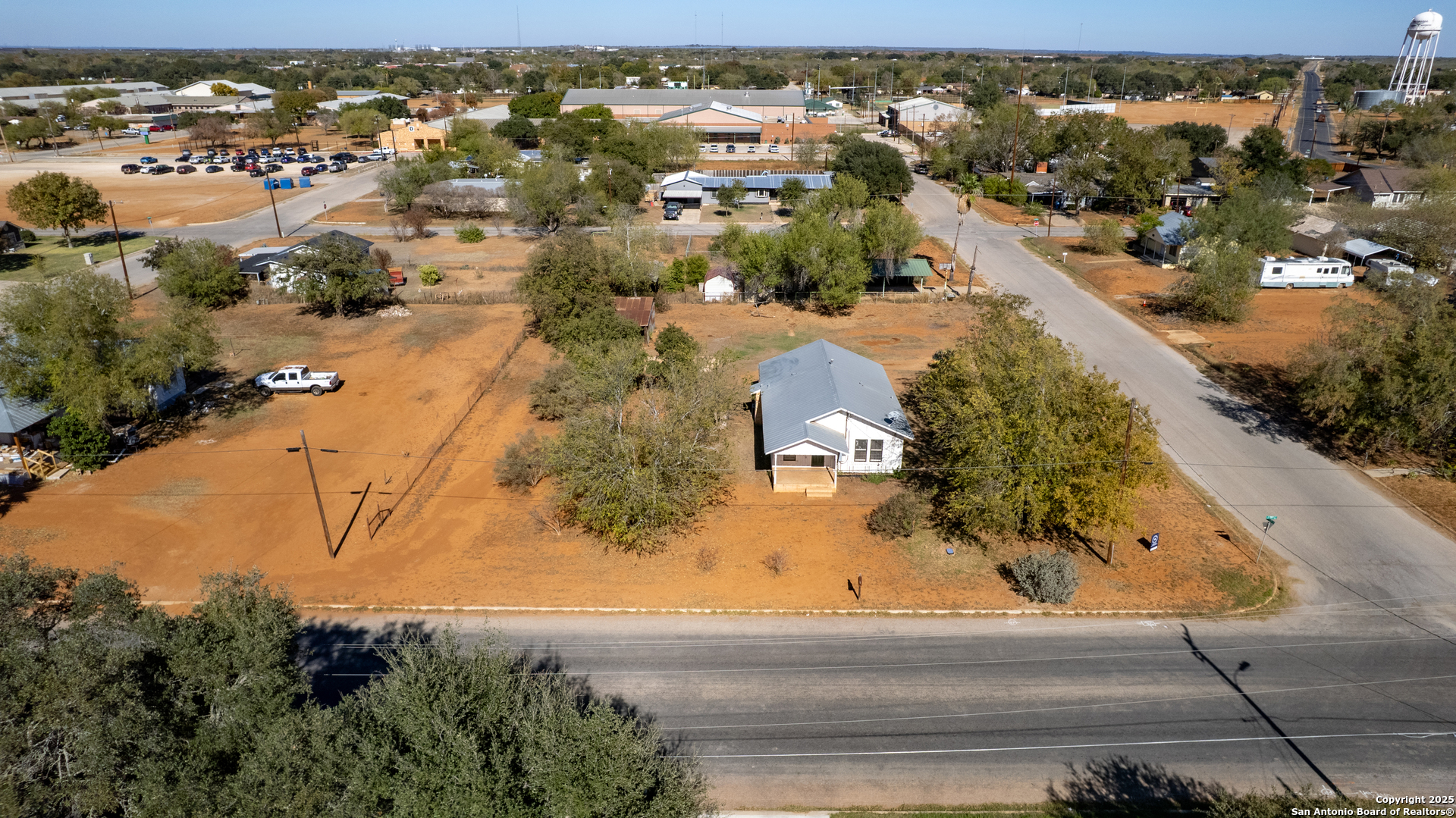 719 East Trinity Street Pearsall, TX 78061 - Photo 13 of 26 an aerial view of residential houses with outdoor space