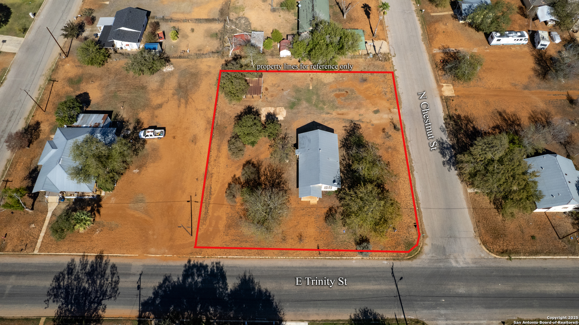 719 East Trinity Street Pearsall, TX 78061 - Photo 14 of 26 an aerial view of a house with a yard