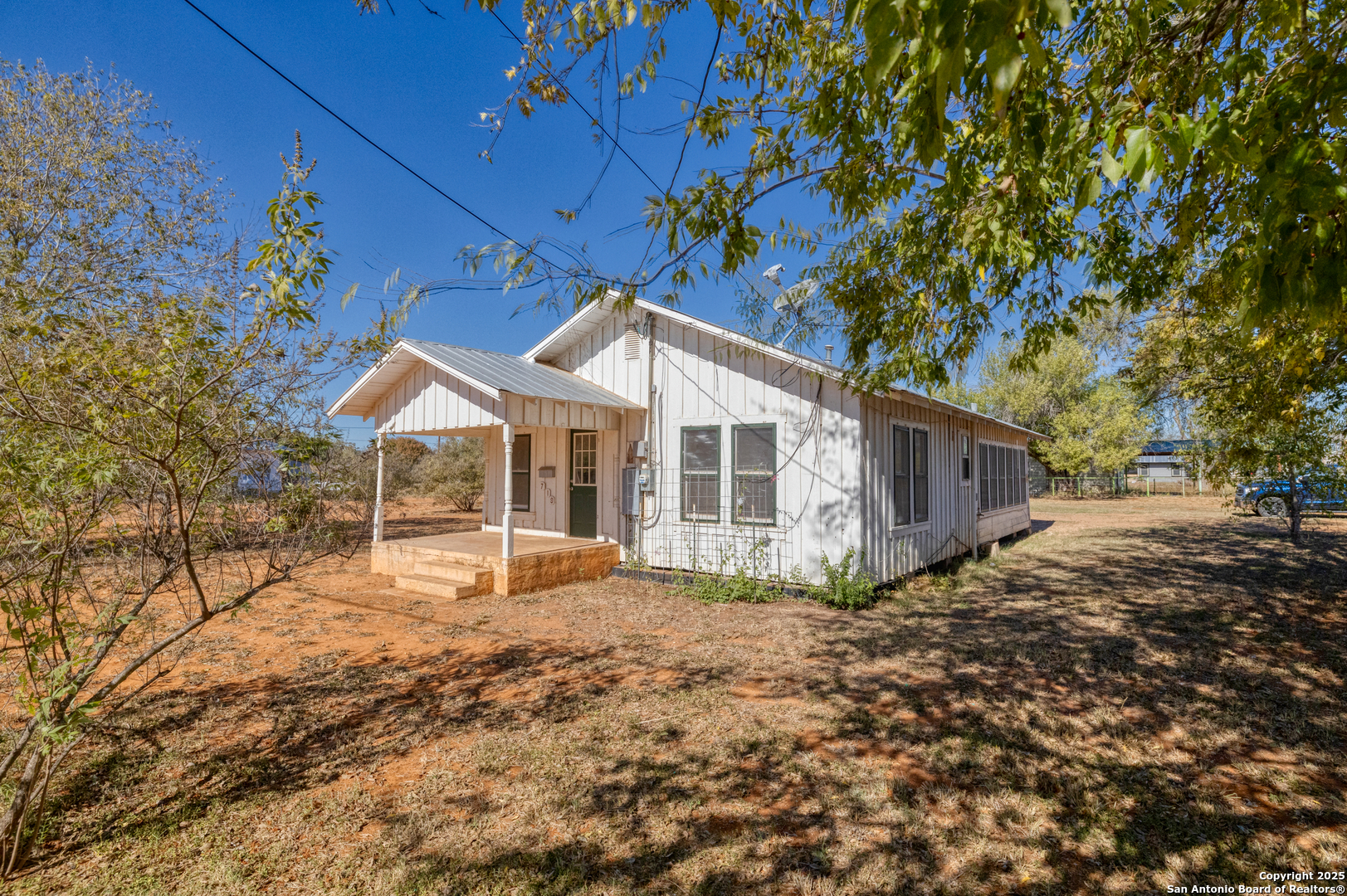 719 East Trinity Street Pearsall, TX 78061 - Photo 3 of 26 a view of a house with a yard