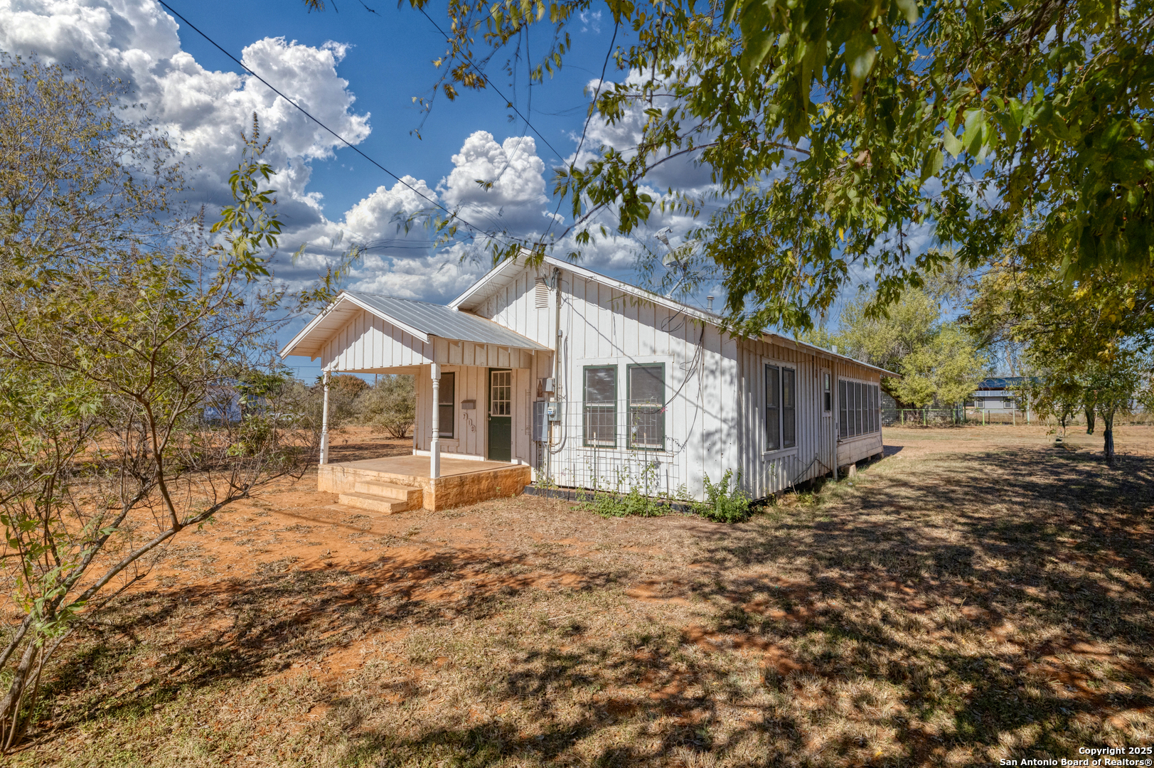 719 East Trinity Street Pearsall, TX 78061 - Photo 4 of 26 a view of a house with a yard