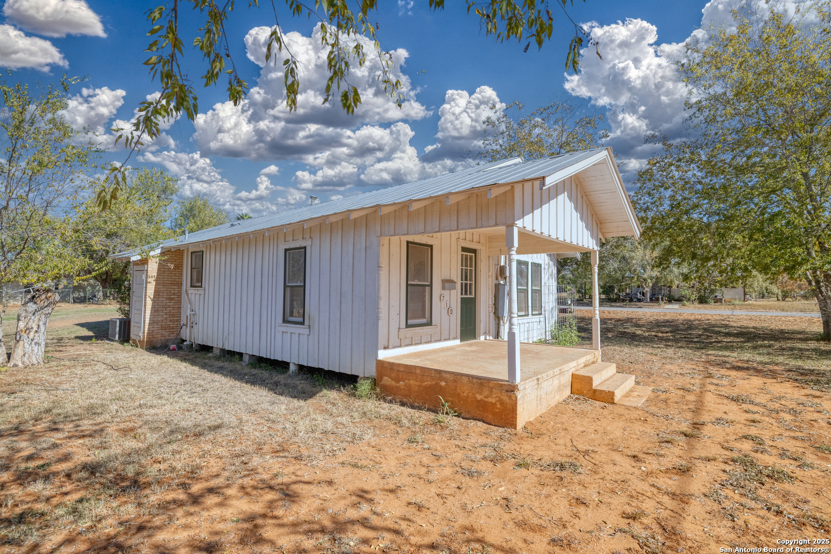 719 East Trinity Street Pearsall, TX 78061 - Photo 6 of 26 a view of a house with a yard