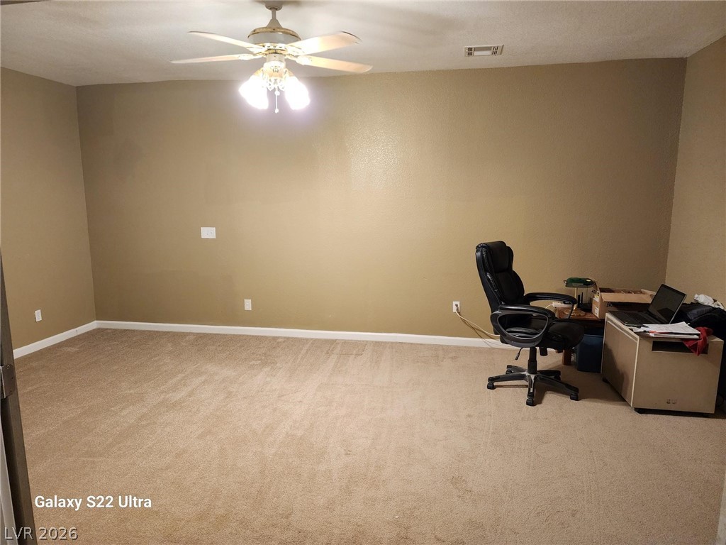 1101 East Blosser Ranch Road Pahrump, NV 89060 - Photo 23 of 50 Office area with ceiling fan and light colored carpet
