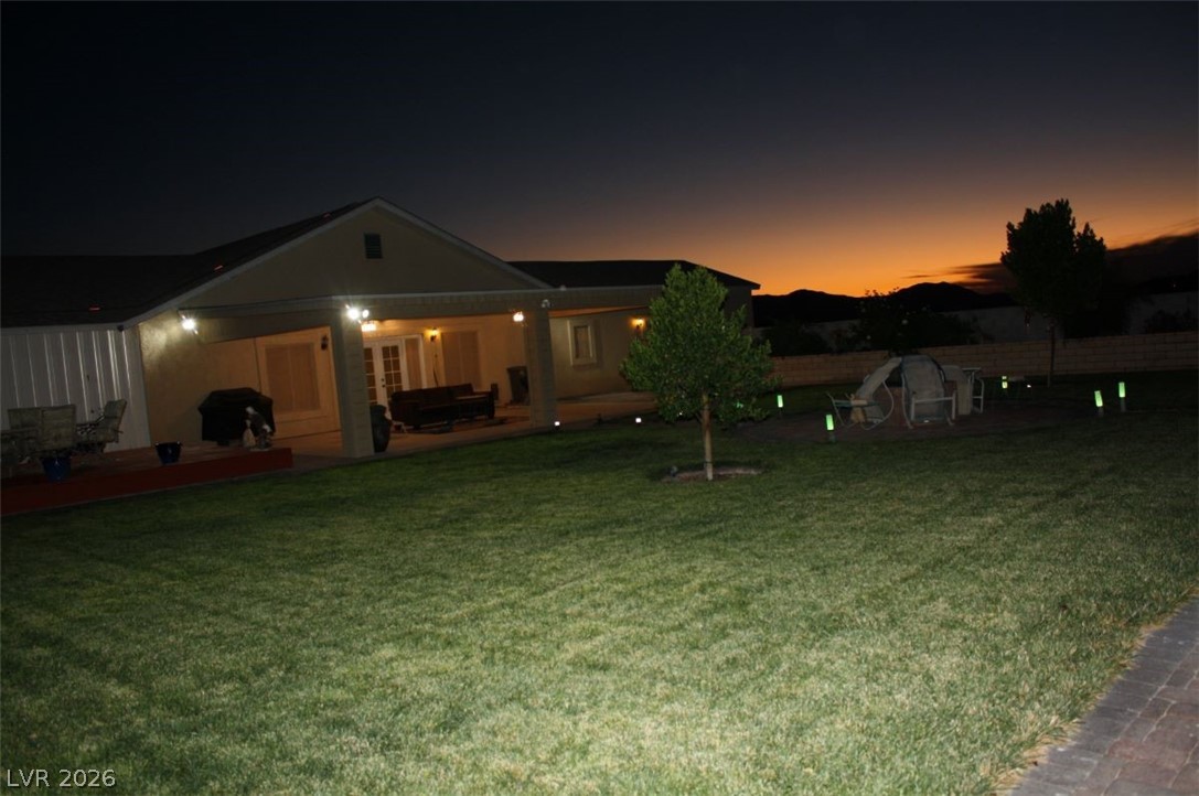 1101 East Blosser Ranch Road Pahrump, NV 89060 - Photo 38 of 50 Rear view of property featuring a patio