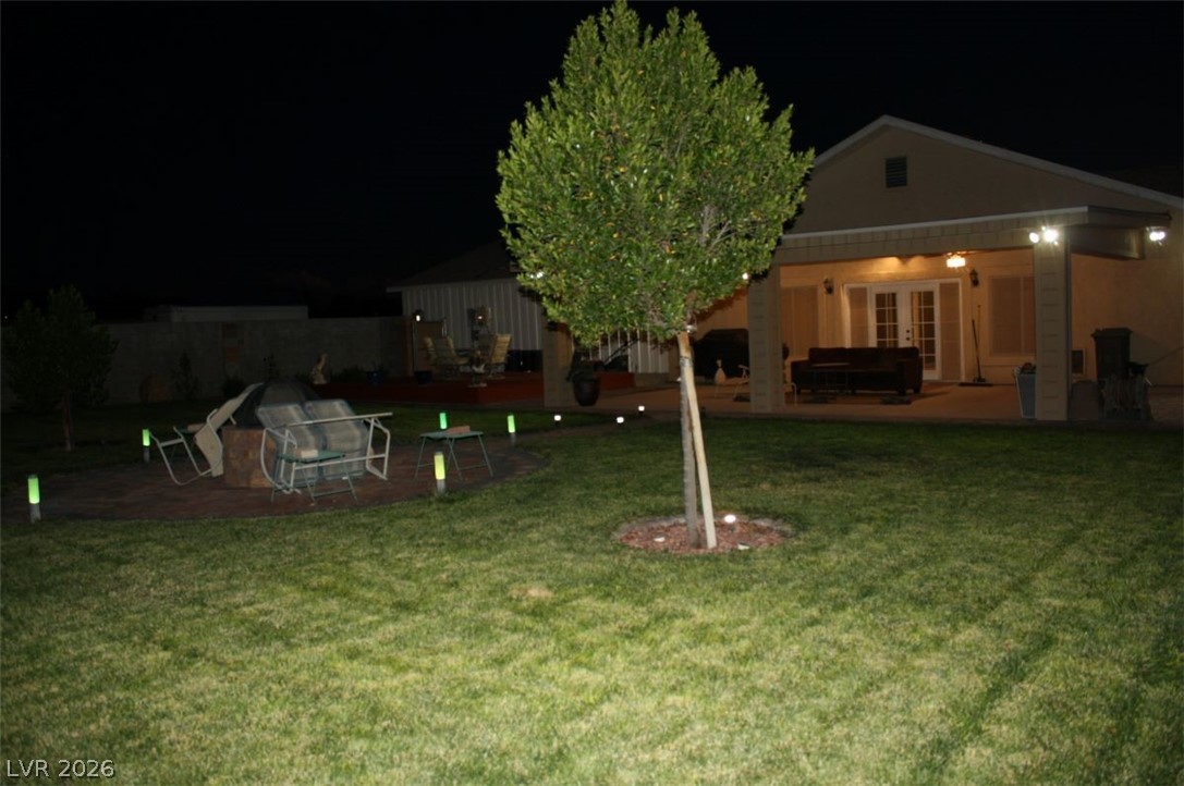 1101 East Blosser Ranch Road Pahrump, NV 89060 - Photo 40 of 50 Yard featuring a patio, french doors, and a yard