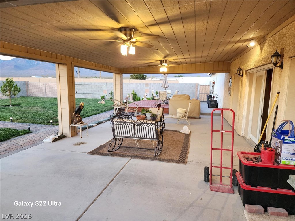 1101 East Blosser Ranch Road Pahrump, NV 89060 - Photo 41 of 50 Fenced backyard featuring a ceiling fan and a patio