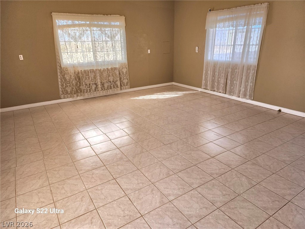 1101 East Blosser Ranch Road Pahrump, NV 89060 - Photo 7 of 50 Main Living Room / Entry area Unfurnished room featuring baseboards