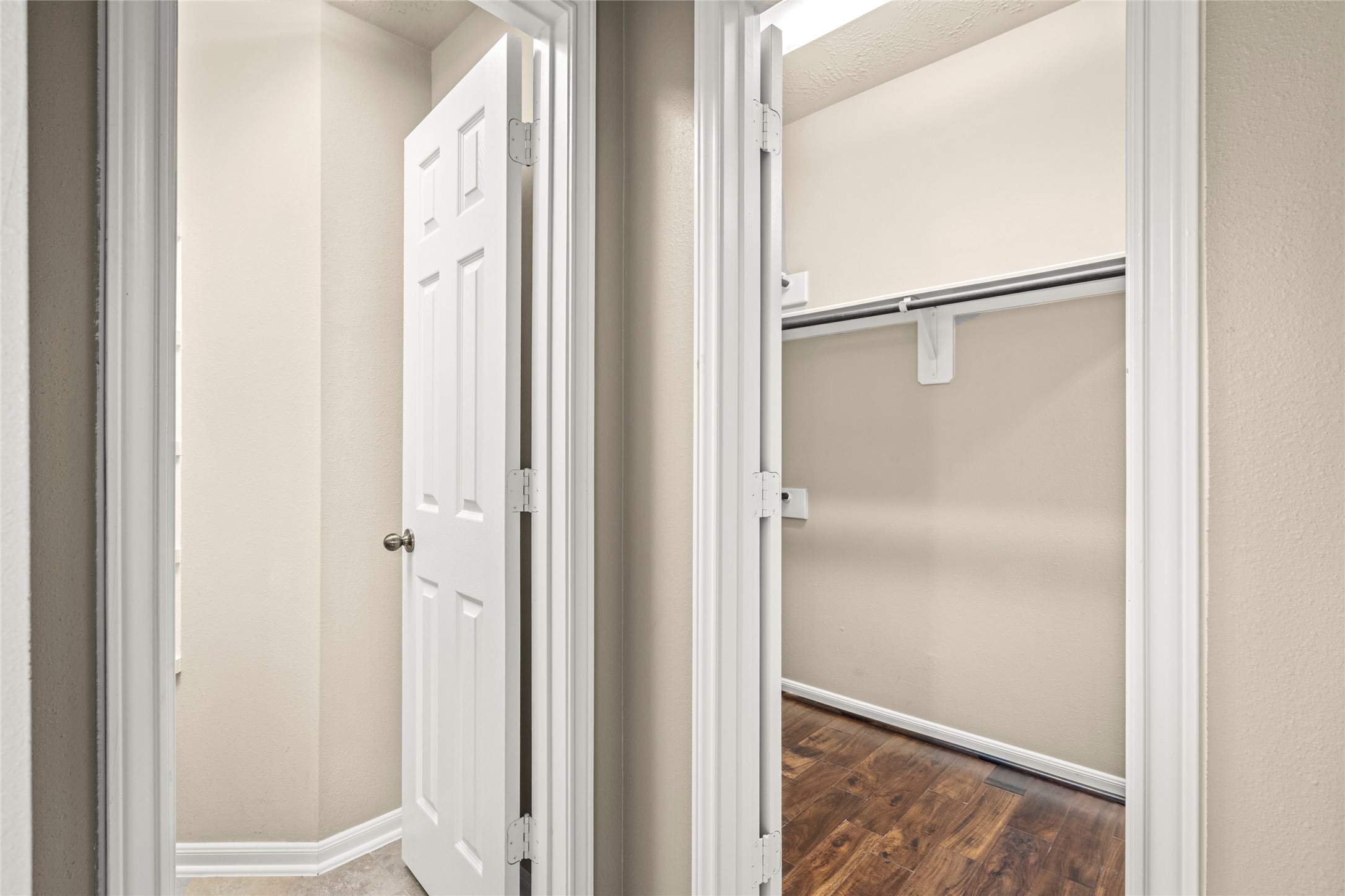 5307 Amber Sky Lane Rosharon, TX 77583 - Photo 26 of 50 This photo shows the entrance to the walk-in closet and ensuite bath of the primary bedroom.