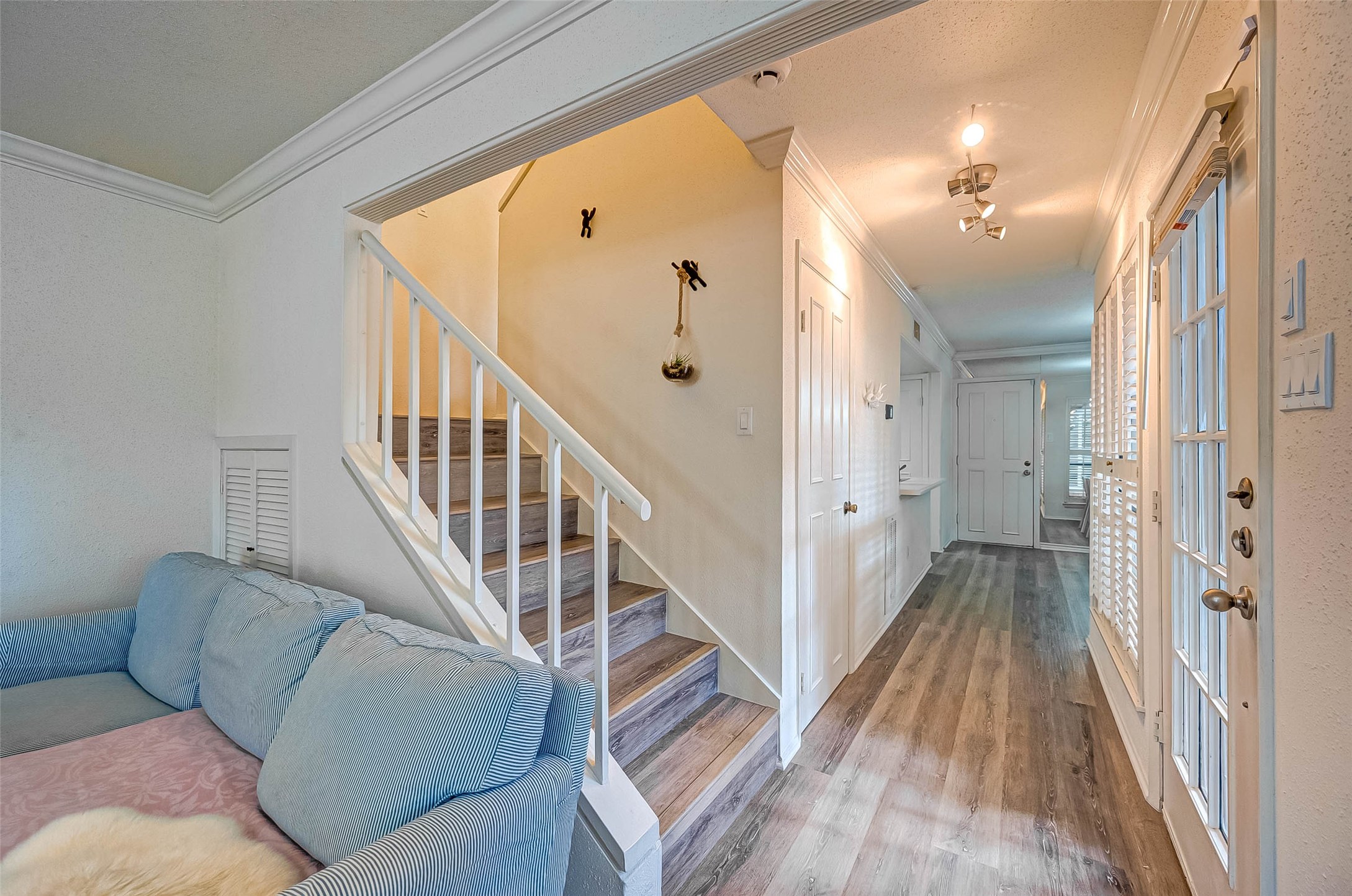 1908 Augusta Drive, Unit 7 Houston, TX 77057 - Photo 7 of 33 a view of livingroom with furniture and stairs