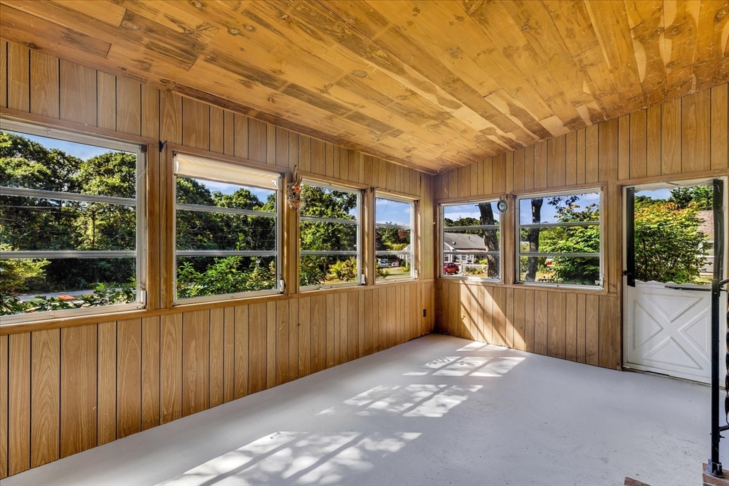 199 Hamden Circle Barnstable, MA 02601 - Photo 12 of 13 a view of a porch with wooden floor and iron stairs