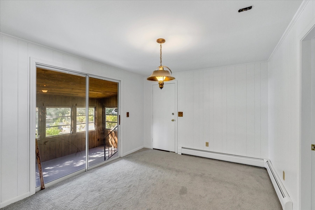 199 Hamden Circle Barnstable, MA 02601 - Photo 7 of 13 an empty room with windows and ceiling fan