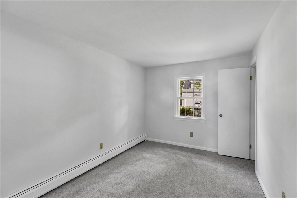 199 Hamden Circle Barnstable, MA 02601 - Photo 9 of 13 a view of an empty room with a window