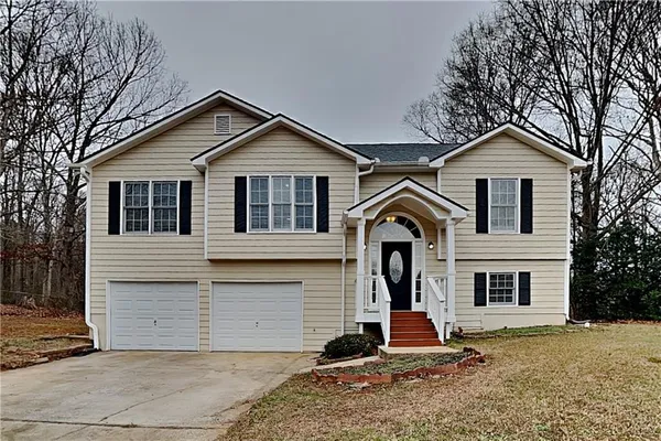 a front view of a house with a yard