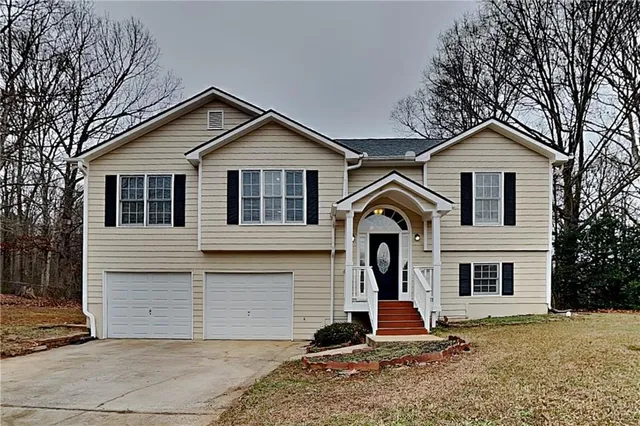 a front view of a house with a yard