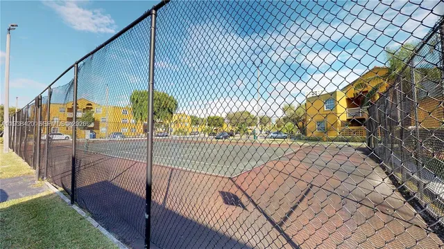 a view of a swimming pool with sitting area