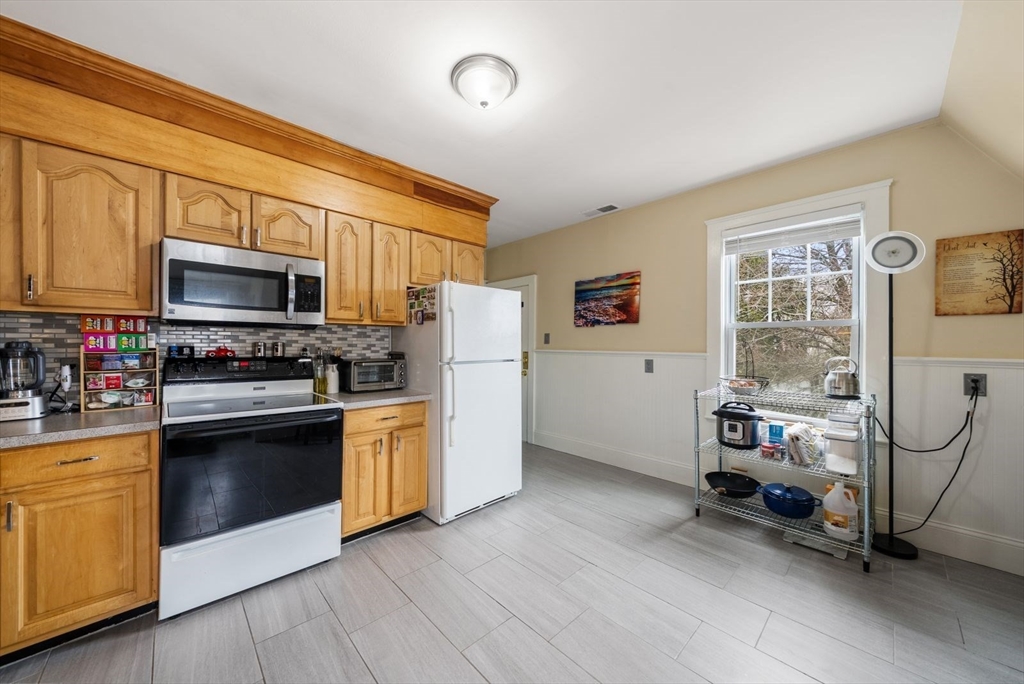 4 Alden Street, Unit 3 Danvers, MA 01923 - Photo 13 of 33 a kitchen with stainless steel appliances a stove a refrigerator and a microwave