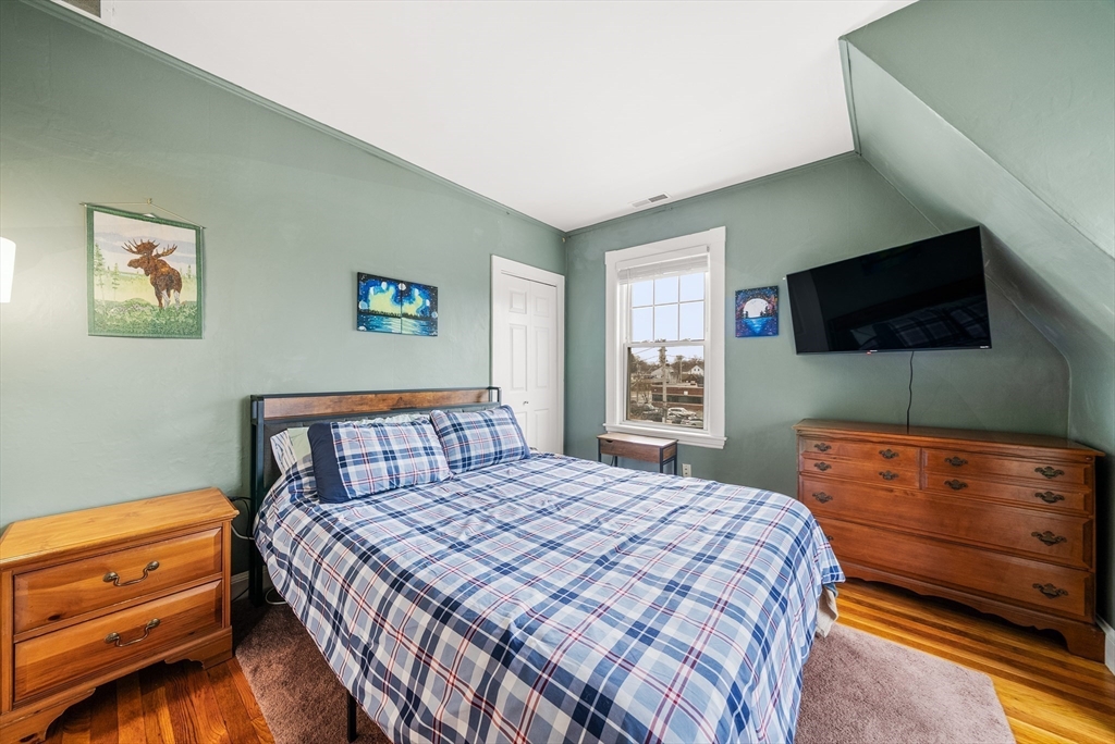 4 Alden Street, Unit 3 Danvers, MA 01923 - Photo 17 of 33 a bedroom with a bed and a flat screen tv