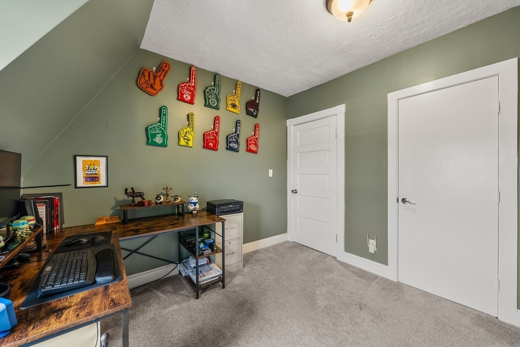 4 Alden Street, Unit 3 Danvers, MA 01923 - Photo 20 of 33 a room with furniture and gym equipment