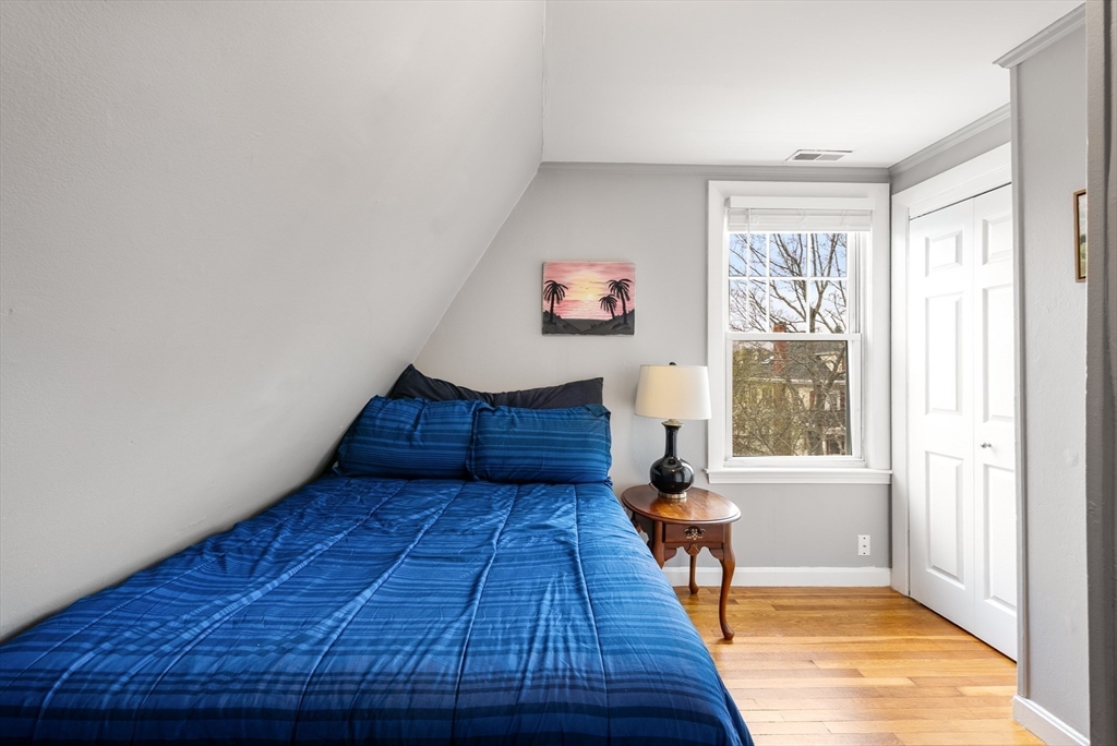 4 Alden Street, Unit 3 Danvers, MA 01923 - Photo 23 of 33 a living room with wooden floor and a large window