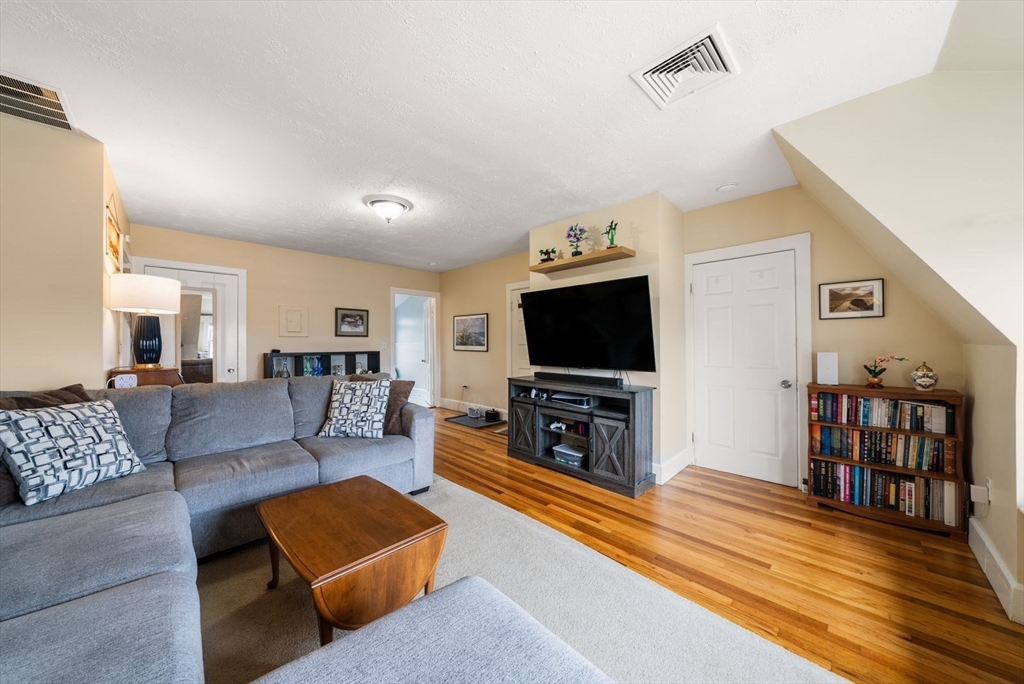 4 Alden Street, Unit 3 Danvers, MA 01923 - Photo 3 of 33 a living room with furniture and a flat screen tv