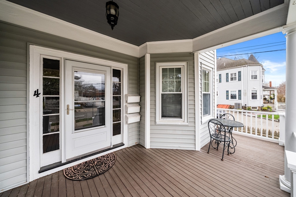 4 Alden Street, Unit 3 Danvers, MA 01923 - Photo 31 of 33 a view of a porch with a table and chairs