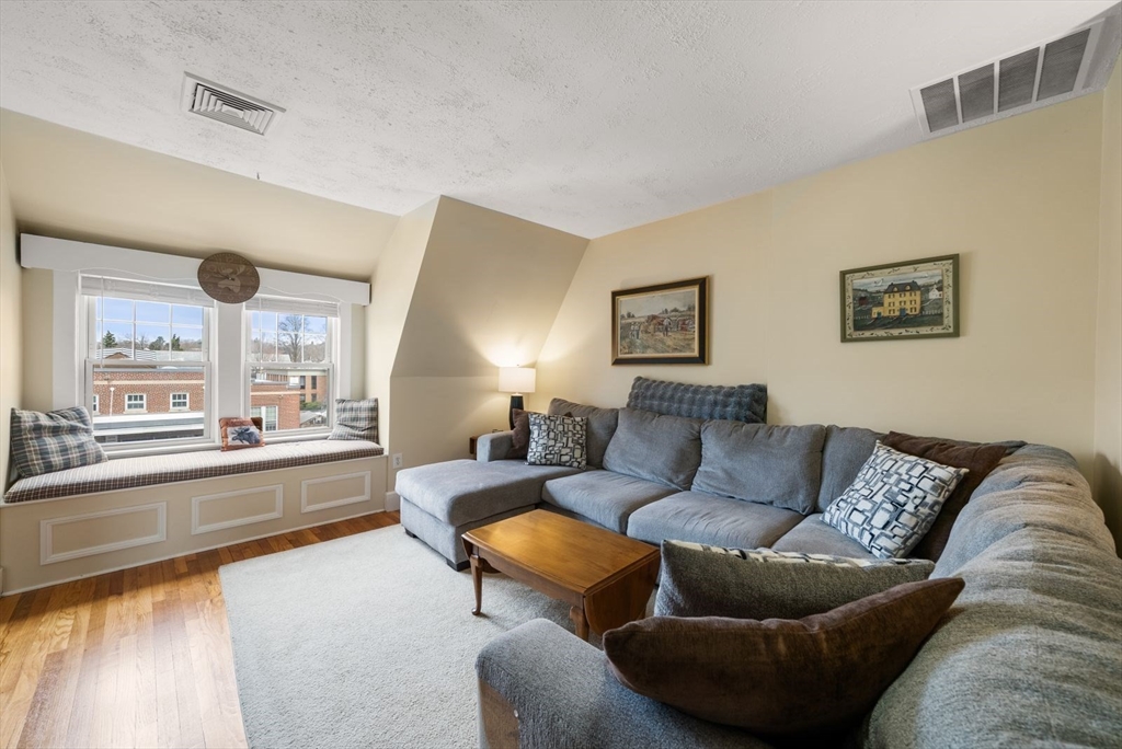 4 Alden Street, Unit 3 Danvers, MA 01923 - Photo 4 of 33 a living room with furniture and a large window