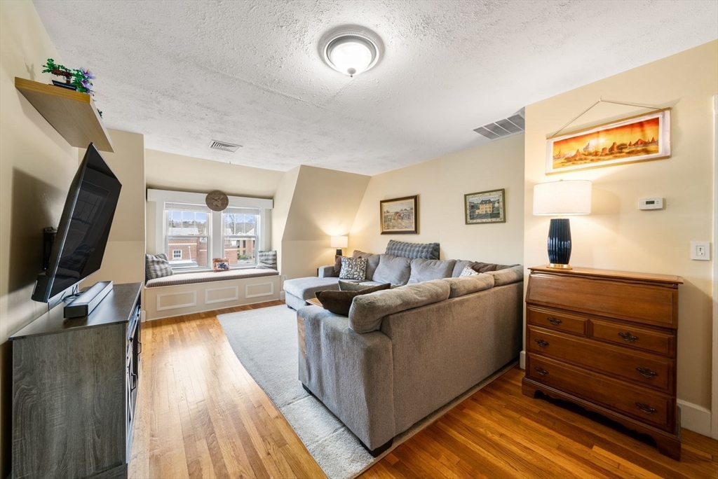 4 Alden Street, Unit 3 Danvers, MA 01923 - Photo 6 of 33 a living room with furniture and a flat screen tv