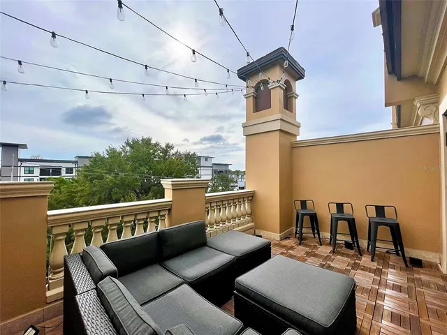 a view of a terrace with furniture