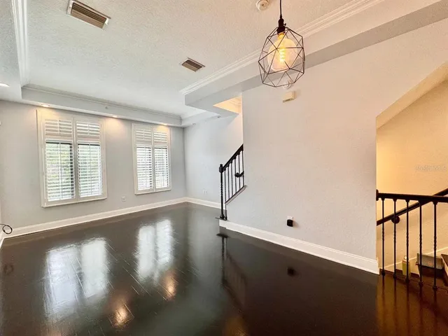 a view of an entryway with wooden floor